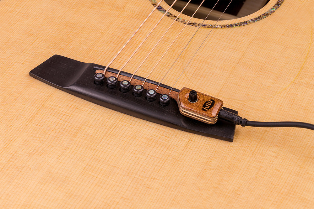 KNA piezo pickup on guitar bridge KNA piezo pickup on guitar bridge