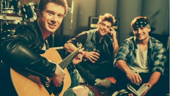 Friends playing guitar and having fun Friends playing guitar and having fun