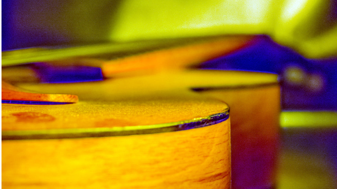 close up of bottom edge of guitar close up of bottom edge of guitar