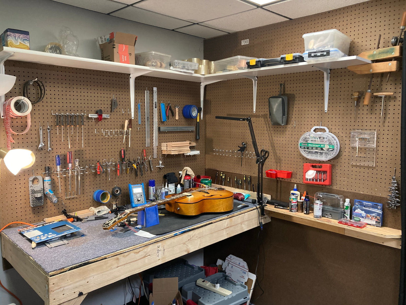 A guitar on service bench A guitar on service bench