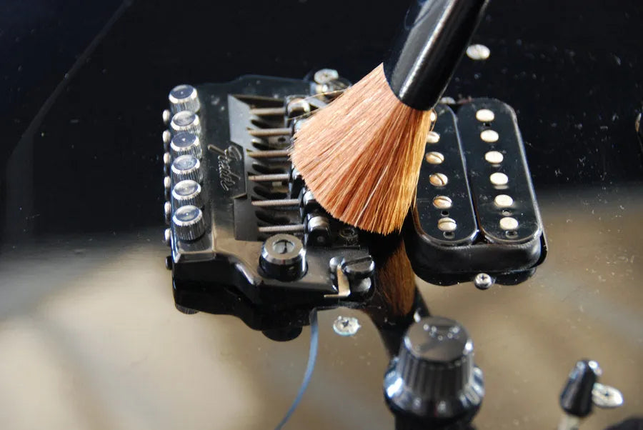 guitar bridge getting brushed clean guitar bridge getting brushed clean