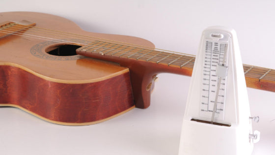 A metronome and guitar A metronome and guitar