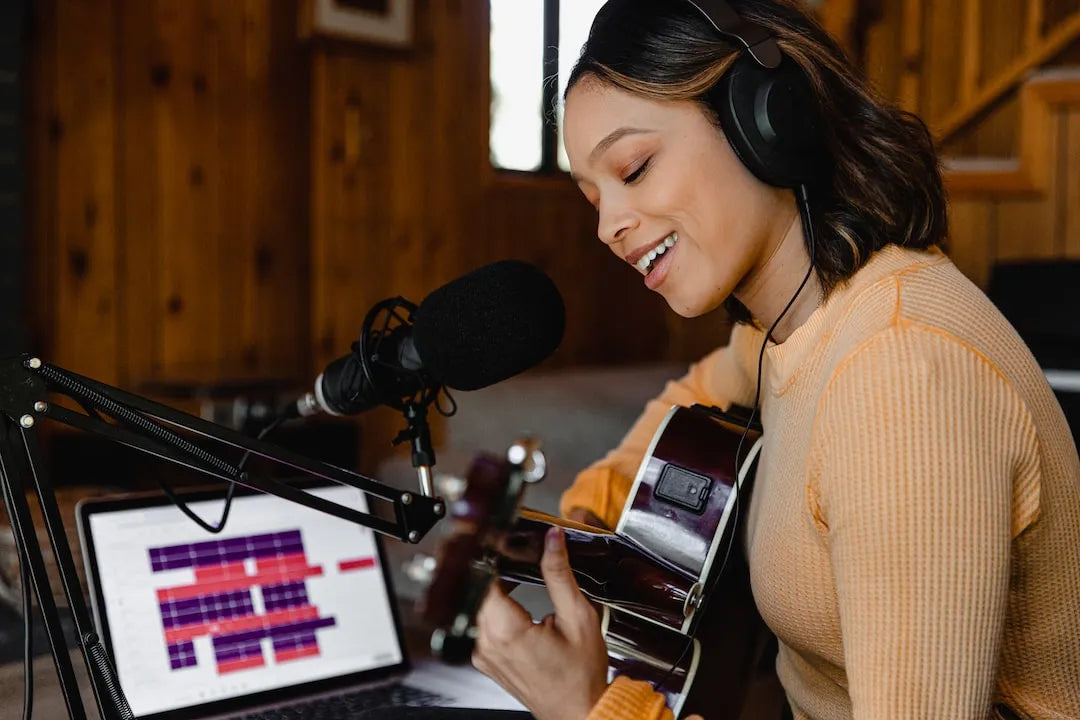 Woman getting online guitar lessons Woman getting online guitar lessons