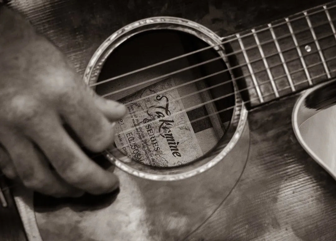 close up of guitar being strummed close up of guitar being strummed