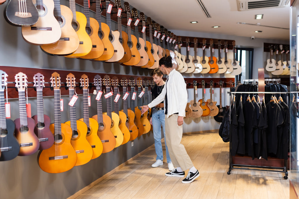 Acoustic guitars on showroom wall Acoustic guitars on showroom wall