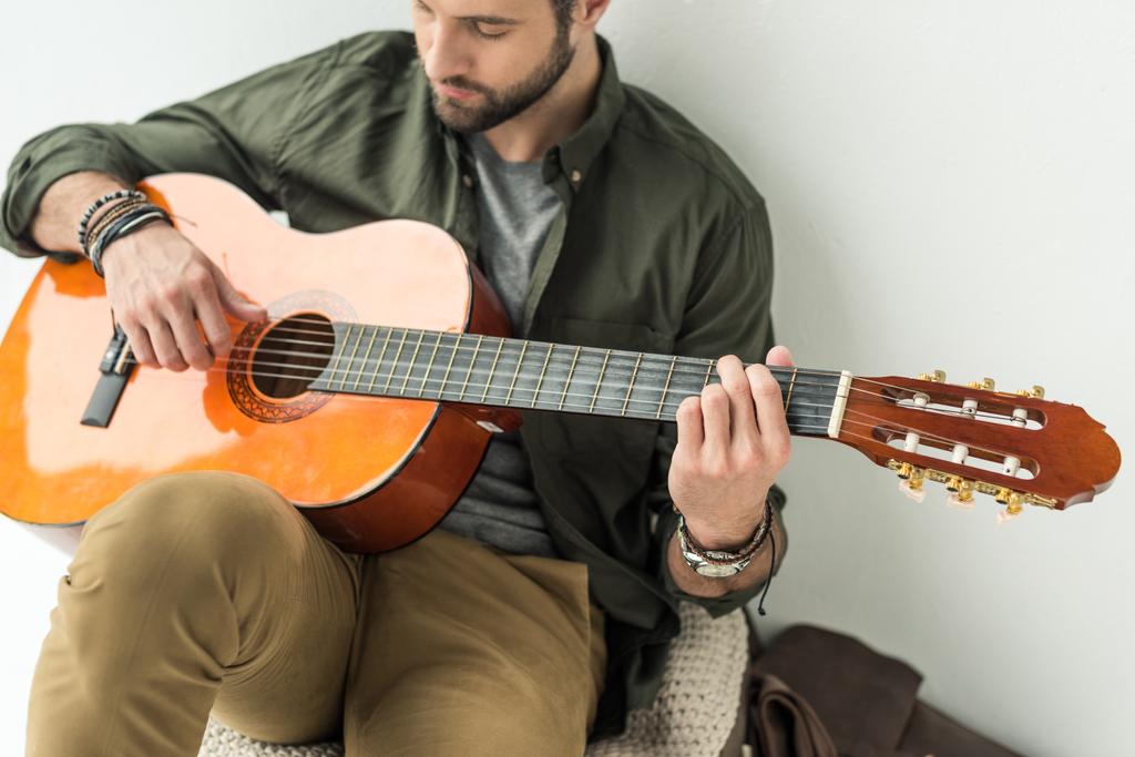 man playing classical guitar man playing classical guitar