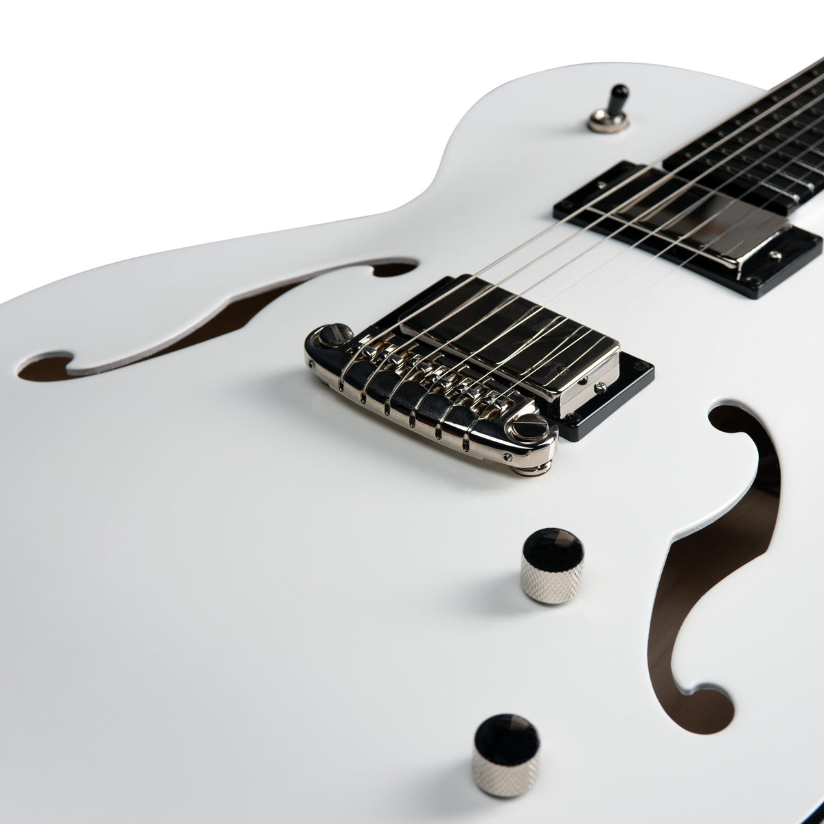 Close-up of a white Godin Rik Emmett Premiere Electric Guitar body by Godin, highlighting the f-holes, bridge, pickup, control knobs, and a portion of the fretboard on this limited edition model.