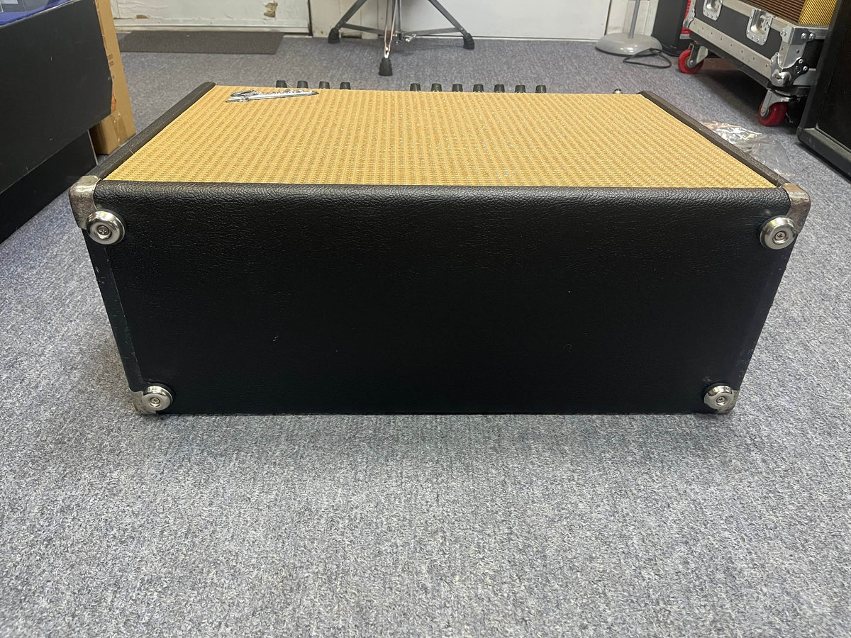 A 1966 Fender Black Panel Twin Reverb 2-Channel 85-Watt 2x12" Guitar Combo Amp w/Case sits on a grey carpeted floor, its blackface design and tan grille cloth evoking classic Fender spring reverb tones.
