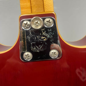 Close-up of a Vox 1967-68 Sidewinder IV Bass (V272) Cherry neck plate with serial number 396995, four screws, and a partially worn "SUPERMODERN" sticker.