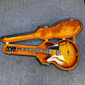 1967 Gibson ES-335 Sunburst electric guitar in an open case, showcasing its vintage design and craftsmanship.