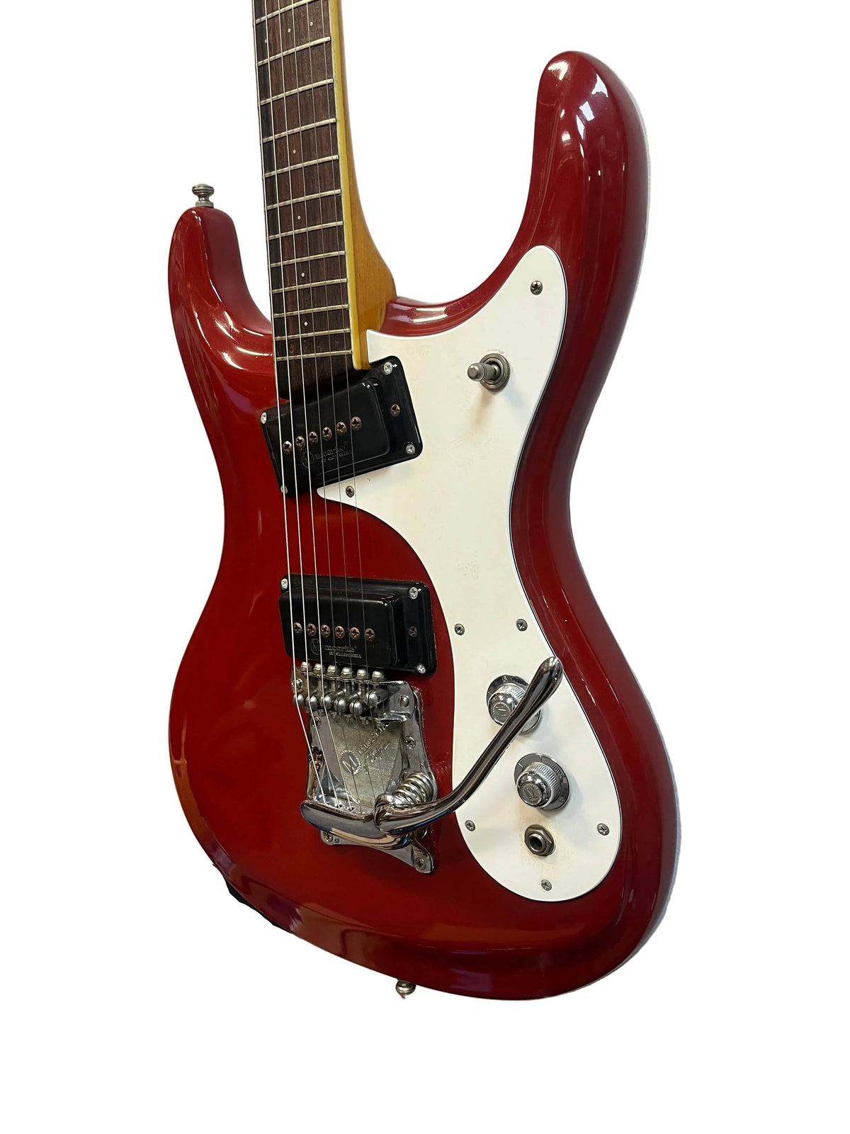 A 1967 Mosrite Mark I Vintage Guitar by Mosrite, featuring a red finish, white pickguard, two black humbucker pickups, control knobs, selector switch, and tremolo arm—evoking American guitar heritage—set against a white background.