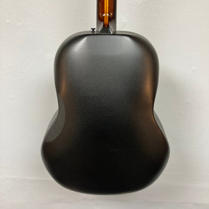 Back view of a matte black 1976 Ovation 1112-1 Acoustic Guitar w/Case, featuring a wooden neck and Lyrachord rounded back by Ovation, shown against a white background.