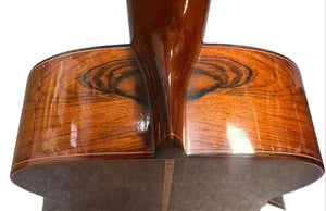 Close-up of the back and neck joint of a 1976 S. Yairi No. 880 Classical Guitar by S Yairi, made in Japan, highlighting the rich wood grain and glossy finish—possibly Brazilian rosewood.