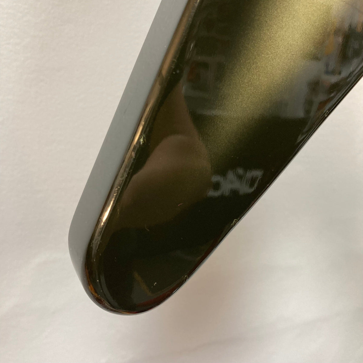 Close-up of a 1979 Gibson Flying V Silverburst guitar, showing its iconic shape and minor blemishes.