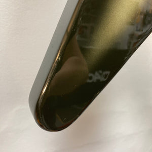Close-up of a 1979 Gibson Flying V Silverburst guitar, showing its iconic shape and minor blemishes.
