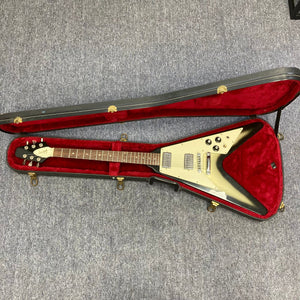 1979 Gibson Flying V Silverburst in original case, showcasing its vintage charm and minor blemishes, available at Guitars on Main.