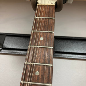 1979 Gibson Flying V Silverburst guitar neck close-up with visible strings; original case included.