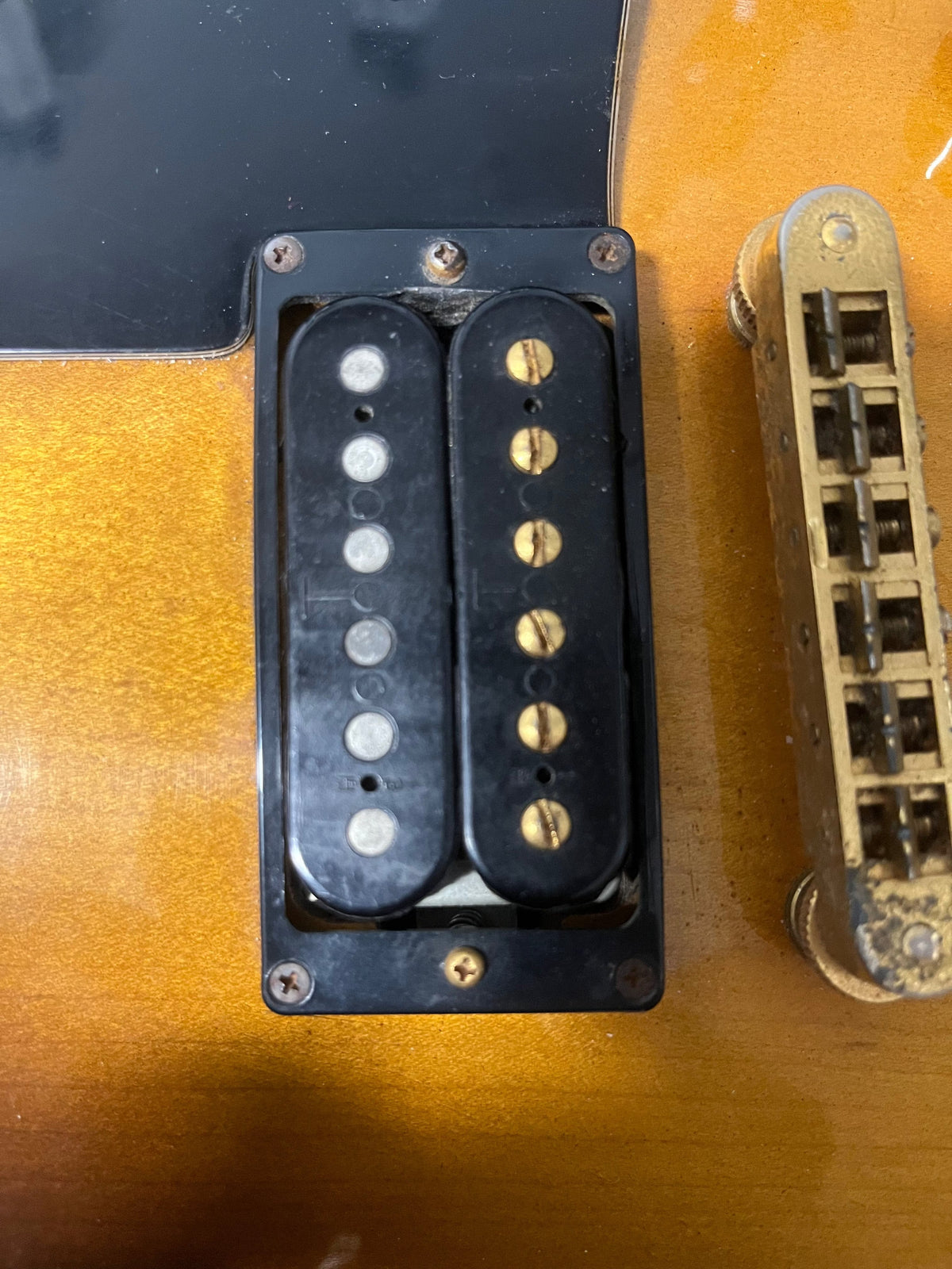 A close-up of the 1980 Gibson Les Paul Custom in Tobacco Sunburst, highlighting its iconic finish and classic design.