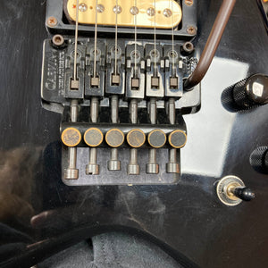 Close-up of a 1992 Carvin Ultra V USA electric guitar with Kahler Steeler trem and MJ-wound Seymour Duncan DCJ, showing rust on the fine tuners, strings, control knobs, and switch lever.