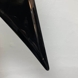 Close-up of a glossy black 1992 Carvin Ultra V USA with Kahler Steeler Trem and MJ‑wound Seymour Duncan DCJ, showing a small chip near the tip against a plain white background.