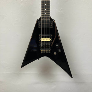 Black 1992 Carvin Ultra V USA guitar with Kahler Steeler tremolo, MJ-wound Seymour Duncan DCJ humbuckers, and control knobs, photographed against a plain light-colored wall.