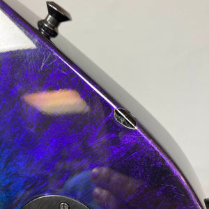 Close-up of a 1995 Jackson SL1 Soloist Custom Shop electric guitar body in the distinctive Eerie Dess Swirl finish, showcasing a prominent screw and visible scratches—details that highlight this USA-made instrument’s authentic character. Includes case.