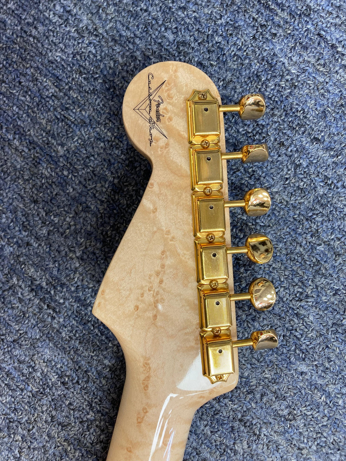 Close-up of a 1998 Fender Custom Shop 1960s FMJ Stratocaster, showcasing meticulous craftsmanship and iconic woodwork.