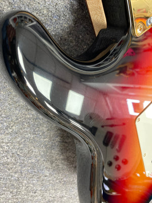 Close-up of a 1998 Fender Custom Shop 1960s FMJ Stratocaster guitar, showcasing its detailed craftsmanship and iconic design.
