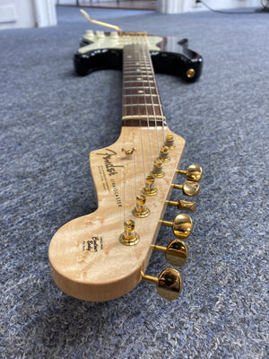 Close-up of a 1998 Fender Custom Shop 1960s FMJ Stratocaster, showcasing meticulous craftsmanship and iconic woodwork.