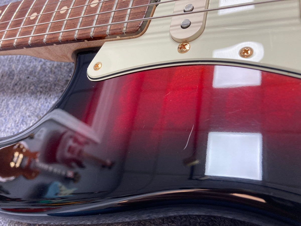 Close-up of the Fender Custom Shop 1960s FMJ Stratocaster 1998 guitar neck and body, showcasing meticulous craftsmanship and vintage design.