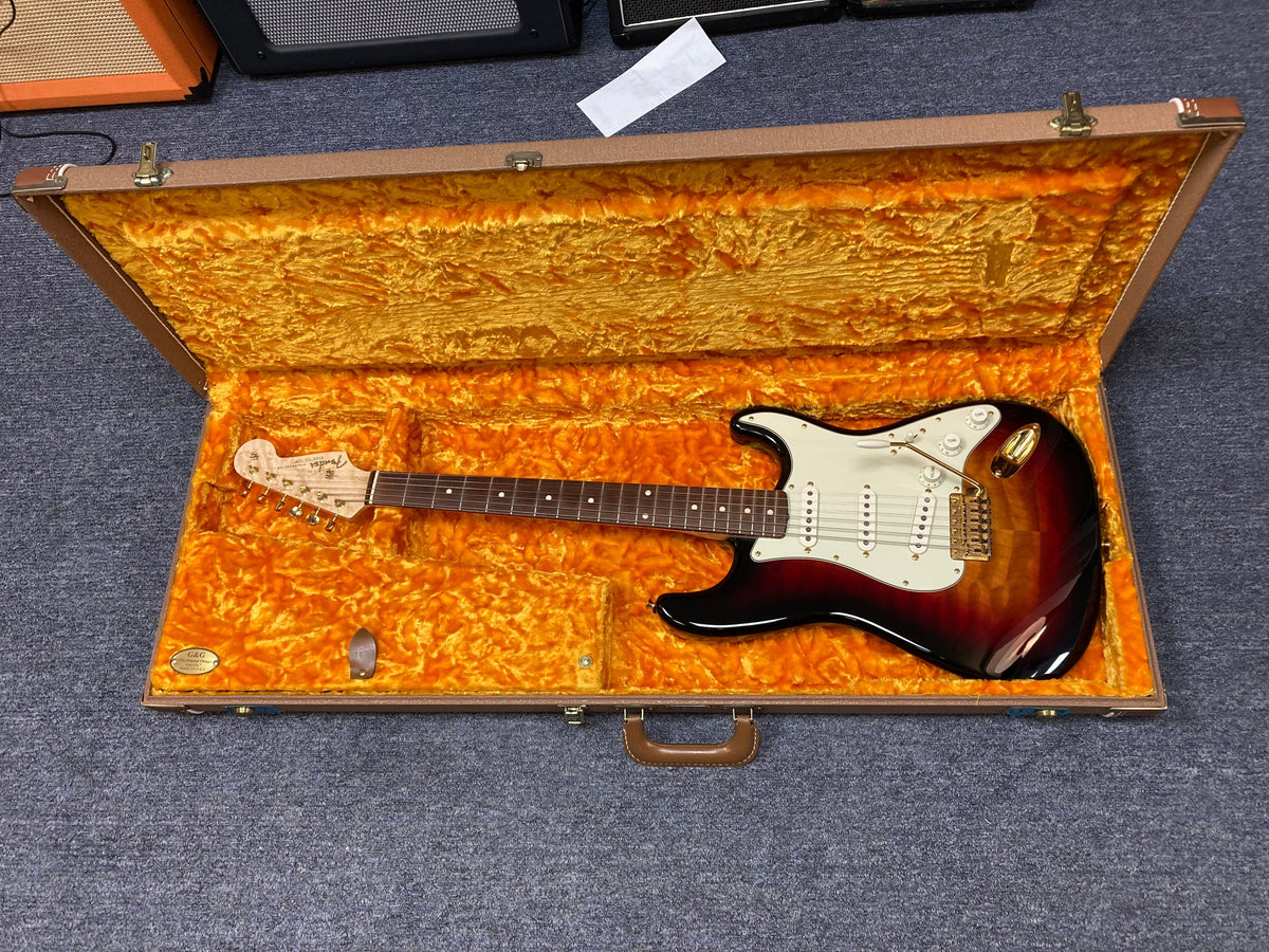 Fender Custom Shop 1960s FMT Stratocaster 1998 in hardshell case, featuring original case candy and certificate of authenticity.