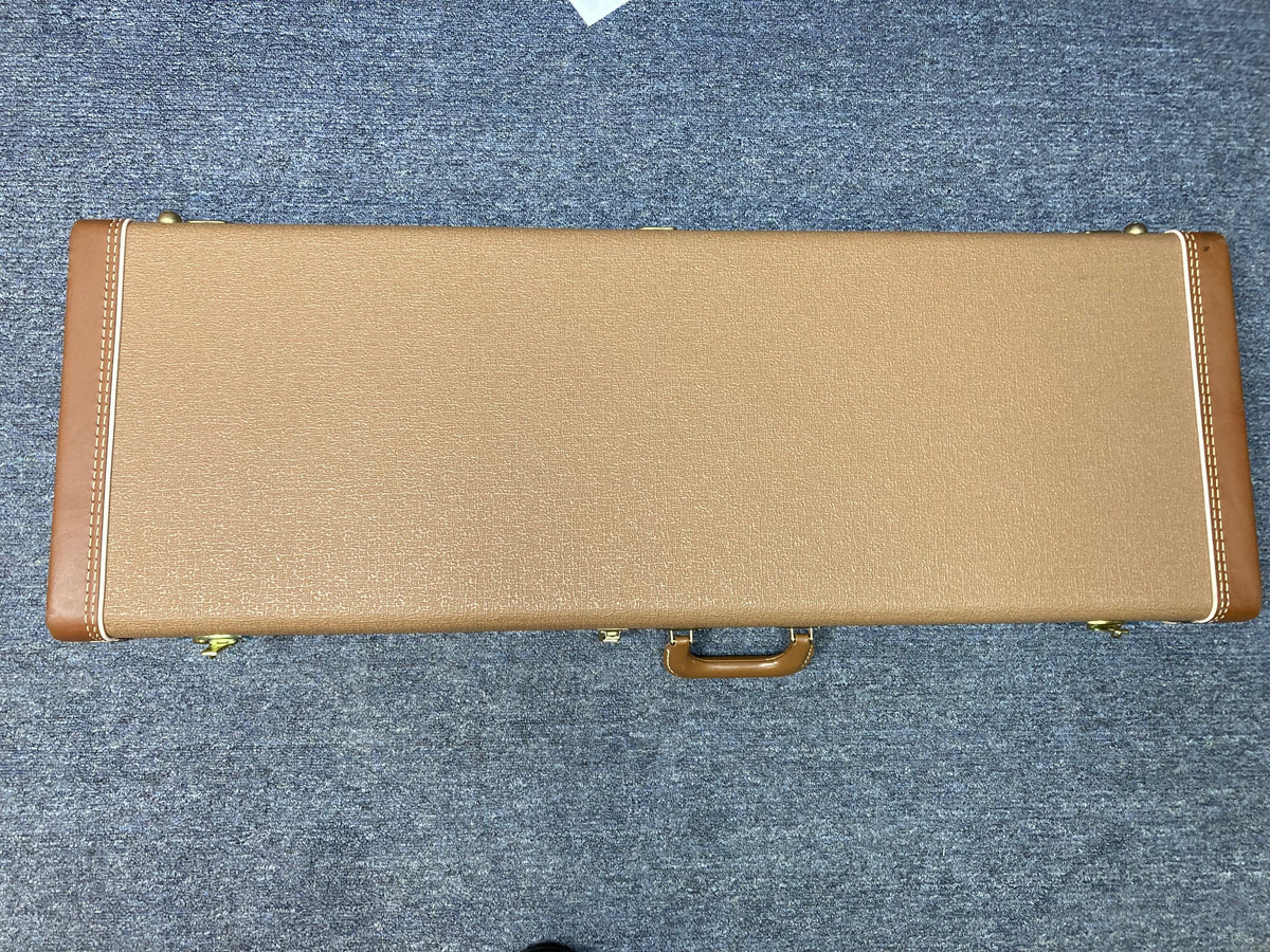 Fender Custom Shop 1960s FMT Stratocaster 1998 in original brown case on blue carpet.
