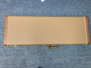 Fender Custom Shop 1960s FMT Stratocaster 1998 in original brown case on blue carpet.