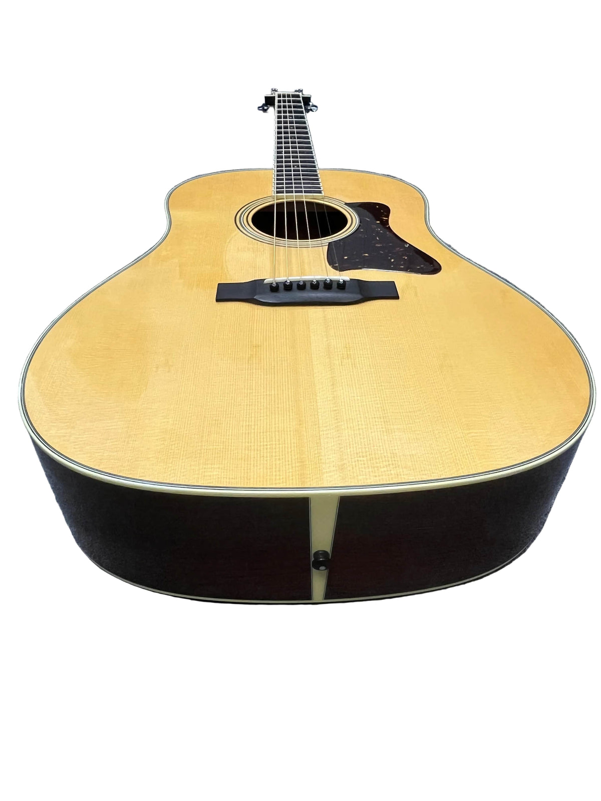A 2005 Collings CJ BaA acoustic guitar, featuring a Brazilian Rosewood body and Adirondack spruce top, is photographed from the base to showcase its wooden body, strings, and sound hole against a white background.