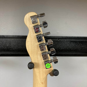 Close-up of the back of a 2007 Fender Standard Telecaster MIM Midnight Wine Red headstock, showing six silver Fender-marked tuning pegs and a "QC APPROVED" green sticker near the bottom, typical for this model.