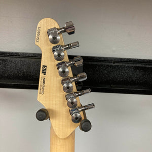 Close-up of the back of a 2019 ESP USA M-II Purple Haze Burst electric guitar headstock, highlighting six tuning pegs, serial number US190503, and ESP manufacturer details engraved on light wood. This American-made instrument exemplifies exceptional craftsmanship and includes a matching case.