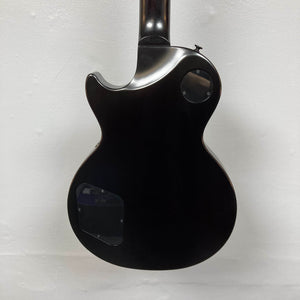 The back of the 2025 Gibson Les Paul Studio Modern in Smokehouse Satin features two plastic cover plates and is displayed against a plain white background.
