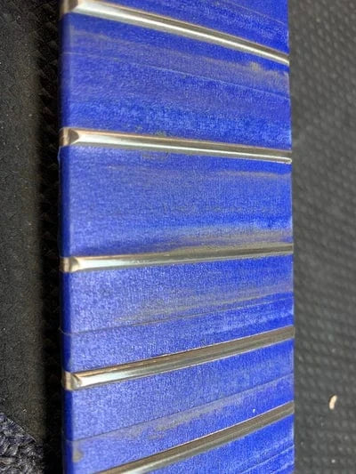 Fret work on guitar neck Fret work on guitar neck