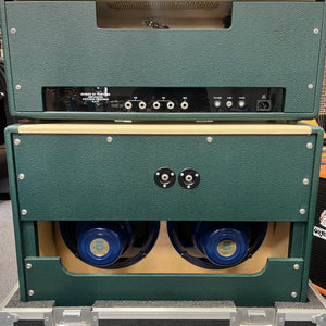 Rear view of a 2005 Divided by 13 RSA 31 Head with matching 2x12 cabinet shows the control panel, input/output jacks, and two Celestion Alnico Blue speakers inside the lower cab. Brand: Divided by 13.