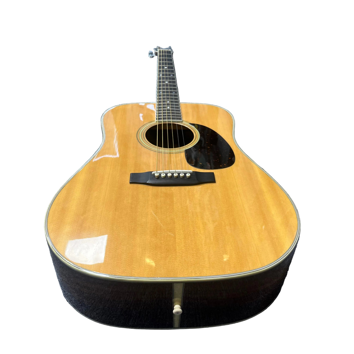 The Vintage Sigma DR-35 Acoustic Guitar w/case, made in Japan by Sigma, features a natural wood finish, six strings, black pickguard, and dreadnought body—photographed on white and inspired by the classic Martin D-35.