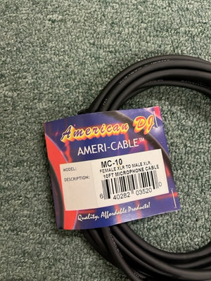 A coiled black American DJ MC-10 10ft XLR Microphone Cable lies on a textured green surface, with a label indicating "Female XLR to Male XLR.