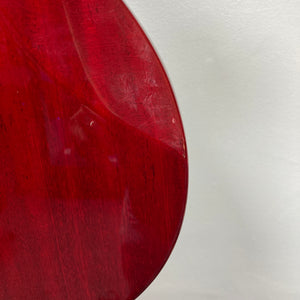 Close-up of the back of an ESP Standard Eclipse Transparent Cherry Red guitar by Esp, showing visible scratches and a small dent—includes case.