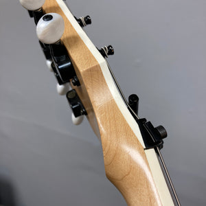 Close-up of an ESP Standard Eclipse Transparent Cherry Red headstock, displaying tuning pegs, nut, and part of the neck against a plain background.