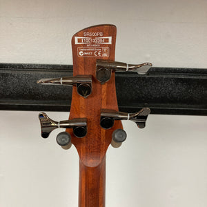 Close-up of the Ibanez SDGR SR500PB bass guitar headstock, showing four tuning pegs and an "SR500PB" label. Includes hard case. Brand: Ibanez.