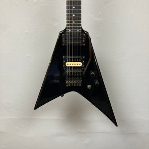 Black 1992 Carvin Ultra V USA guitar with Kahler Steeler tremolo, MJ-wound Seymour Duncan DCJ humbuckers, and control knobs, photographed against a plain light-colored wall.