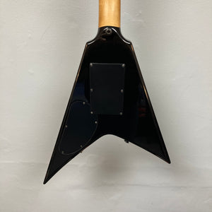 Back view of a 1992 Carvin Ultra V USA guitar body with Kahler Steeler Trem and MJ‑Wound Seymour Duncan DCJ, showing two access panels, against a plain white wall.