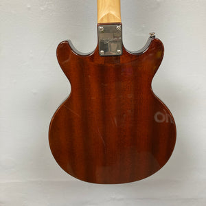 Back view of the Dean Boca Trans Amber Burst 12 String by Dean, featuring a glossy, semi-hollow brown body with visible wood grain, metal neck plate, and slight surface scratches; includes gigbag.