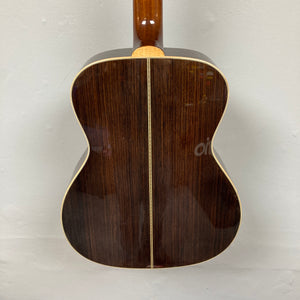 The back of the Guild Gad-30reasb w/Case, an orchestra-size acoustic-electric guitar by Guild, features a dark solid Indian rosewood finish with light binding edges and a vertical center seam, shown against a plain background.
