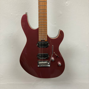 A Cort FW-G300 PRO electric guitar in Vivid Burgundy, featuring two humbucker pickups, three control knobs, and a tremolo bridge, hangs against a white wall.