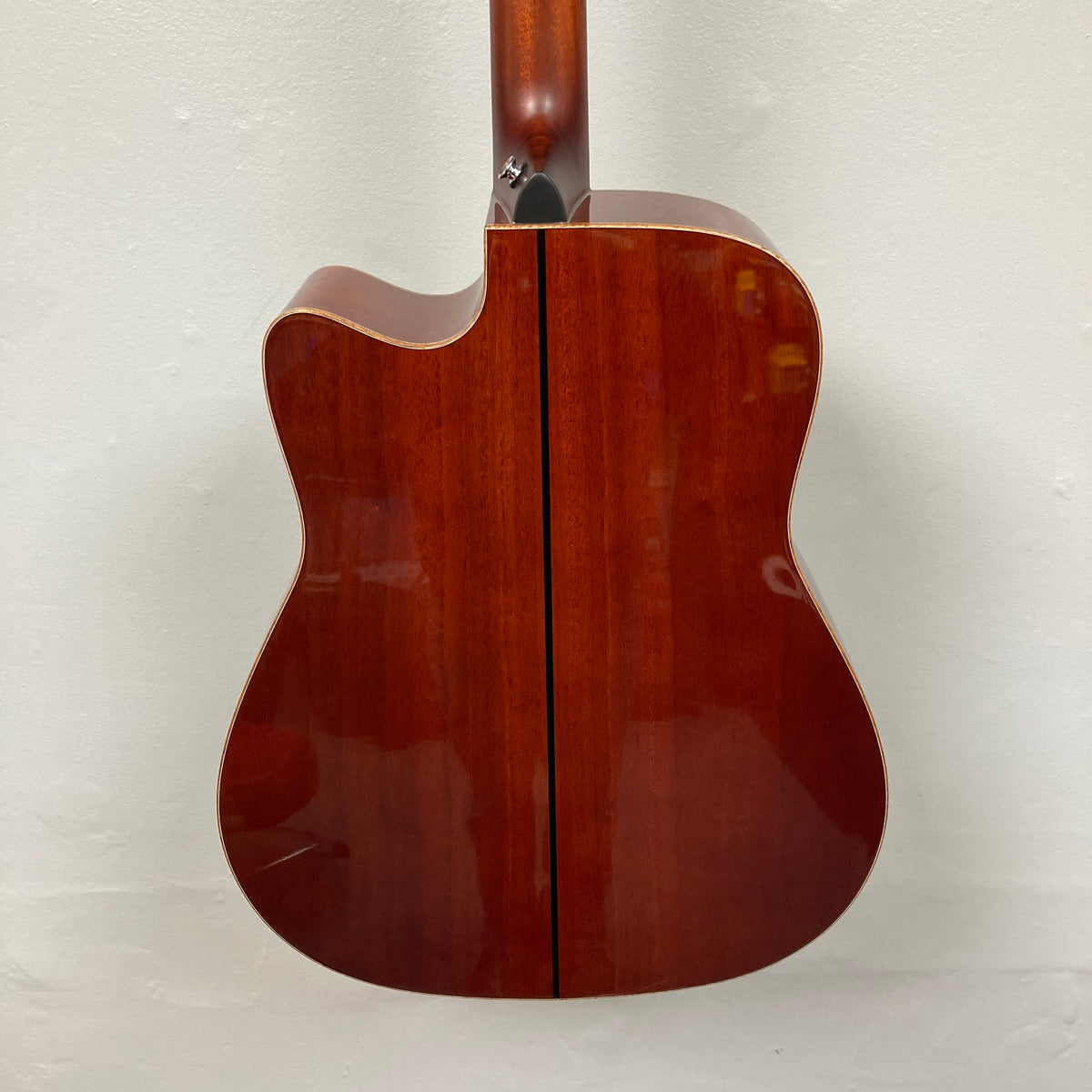 Back view of a Yamaha A3M ARE Vintage Natural Acoustic Guitar w/Hard Bag Used, showcasing its glossy, vintage natural wood finish and cutaway design, photographed against a plain white background. This Yamaha model is equipped with the advanced SRT2 pickup system for superior amplified sound quality.